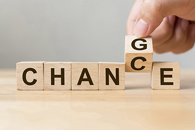 Hand flip wooden cube with word "change" to "chance", Personal development and career growth or change yourself concept